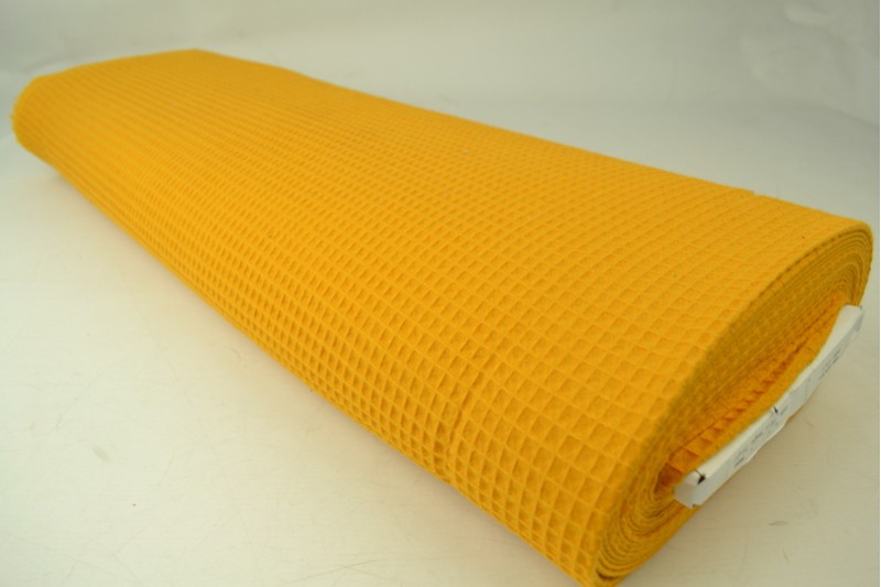 Gaufrette tissu jaune ocre, rouleau